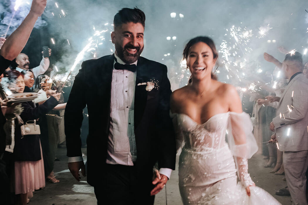A couple walking through Redbird at Vibiana, a converted 1876 cathedral wedding venue in Downtown Los Angeles. Photo courtesy of Redbird | Vibiana.