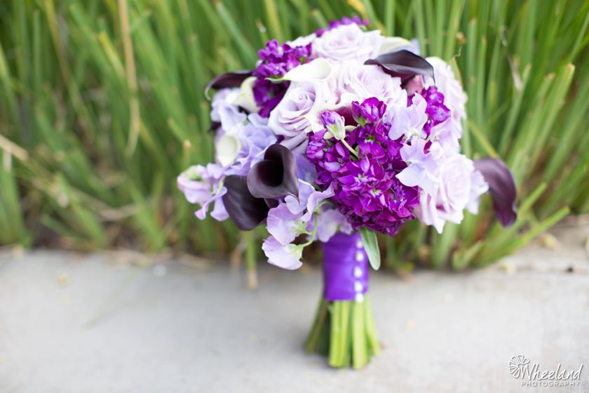 A bridal bouquet of purple and lavender flowers from a Wheeland Photography wedding at Balboa Bay Resort